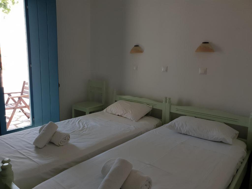 Postel nebo postele na pokoji v ubytování Captain's Rocks Hotel