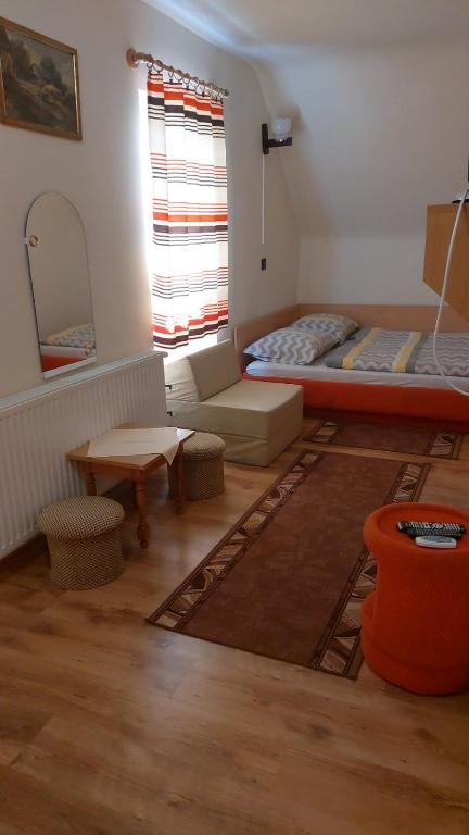 Postel nebo postele na pokoji v ubytování Ádám Vendégház