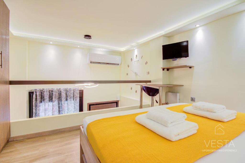 Postel nebo postele na pokoji v ubytování Dahlia City Loft-Apartment, Vesta Philoxenia