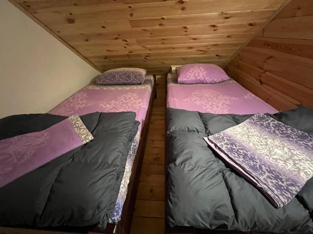 Postelja oz. postelje v sobi nastanitve Dormire Apartmans