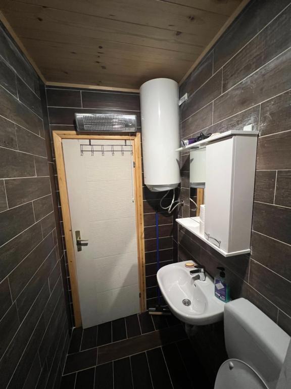 Kopalnica v nastanitvi Dormire Apartmans