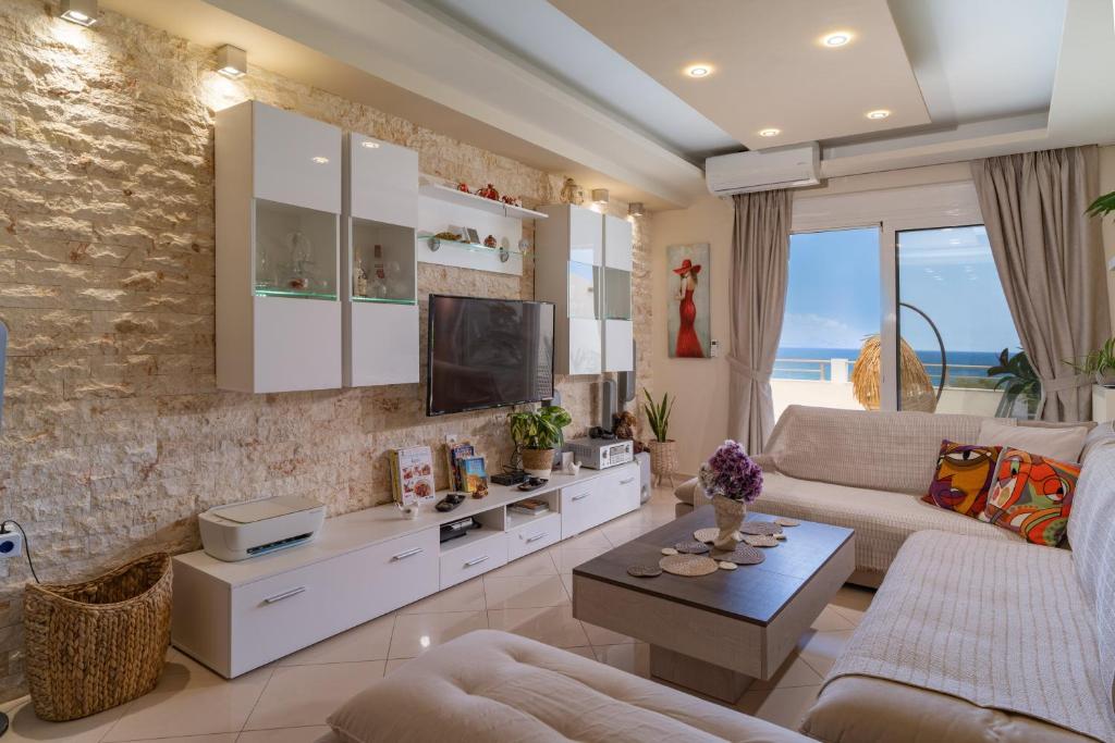 Televízia a/alebo spoločenská miestnosť v ubytovaní View Sea Apartment