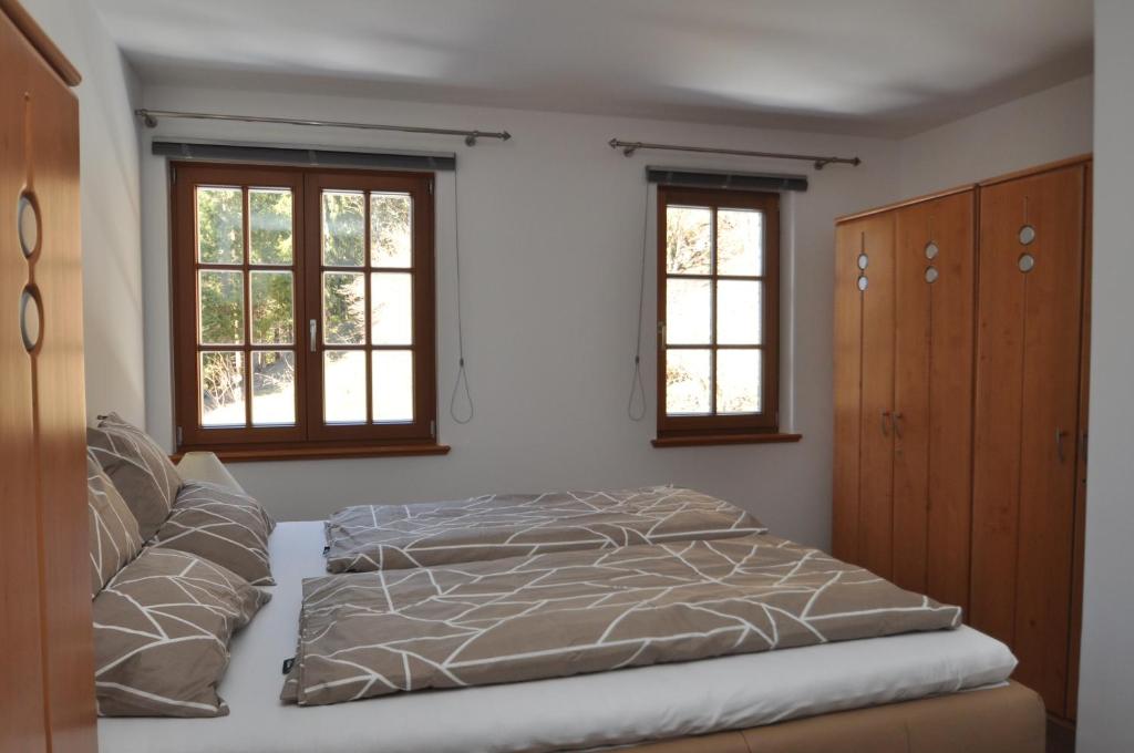 Postel nebo postele na pokoji v ubytování Apartments-Weberlandl