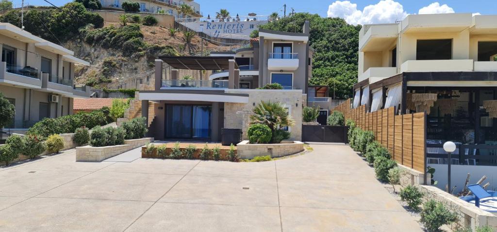 a house with a driveway in front of a mountain at Villy Luxury Home 2 in Ayiá