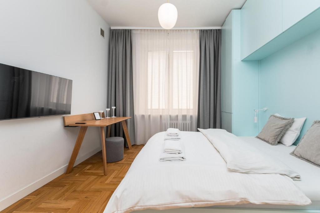 Posteľ alebo postele v izbe v ubytovaní Apartamenty Wawa Centrum by Your Freedom