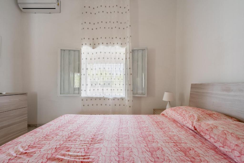Łóżko lub łóżka w pokoju w obiekcie Casa Vacanze Salento