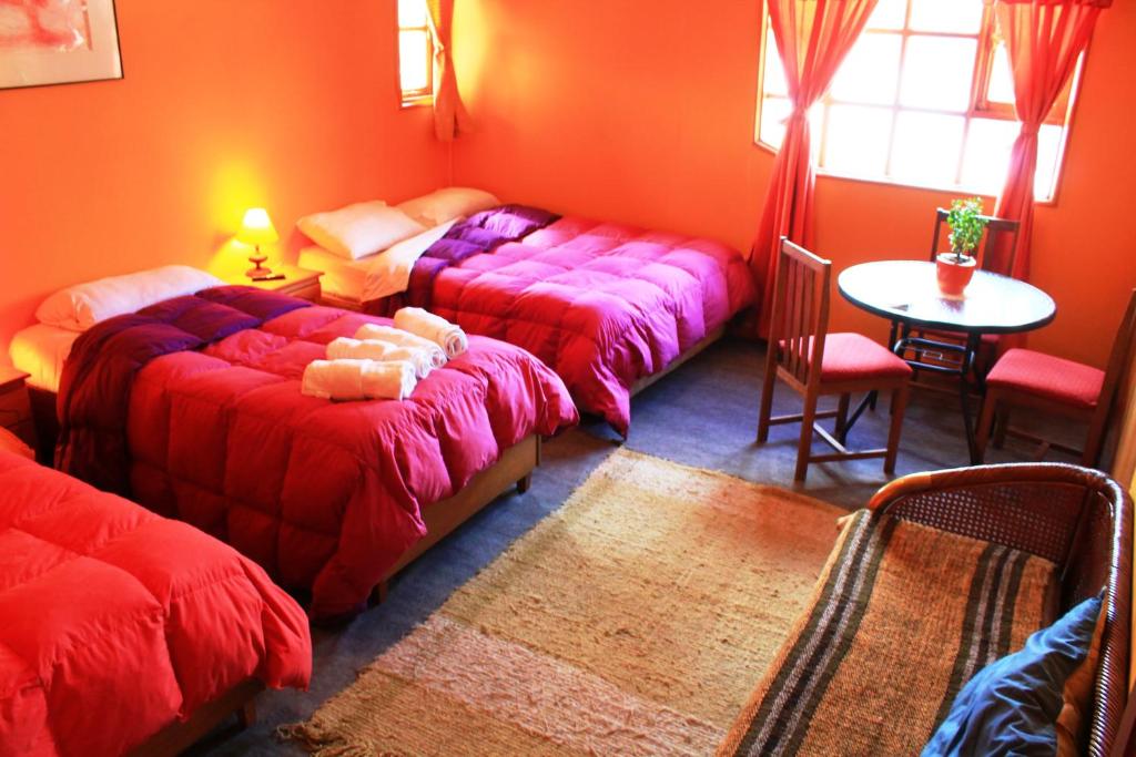 Postel nebo postele na pokoji v ubytování Hostal Torre de Babel