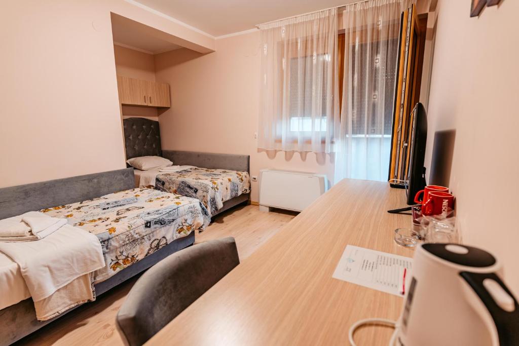 Postel nebo postele na pokoji v ubytování Lotos Depandans