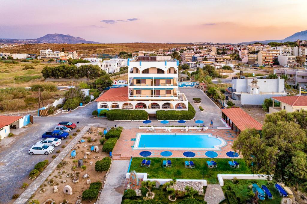 an aerial view of a resort with a swimming pool at Hotel Tsagarakis Beach in Amoudara Herakliou