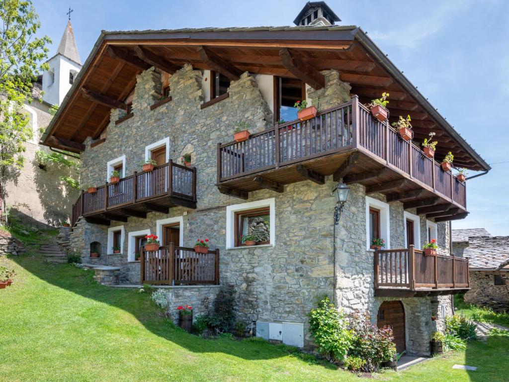 a house with balconies on the side of it at Apartment Ville sur Sarre by Interhome in Sarre