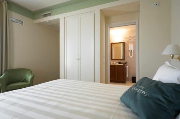 Posteľ alebo postele v izbe v ubytovaní Cora Hotels Leon d'Oro