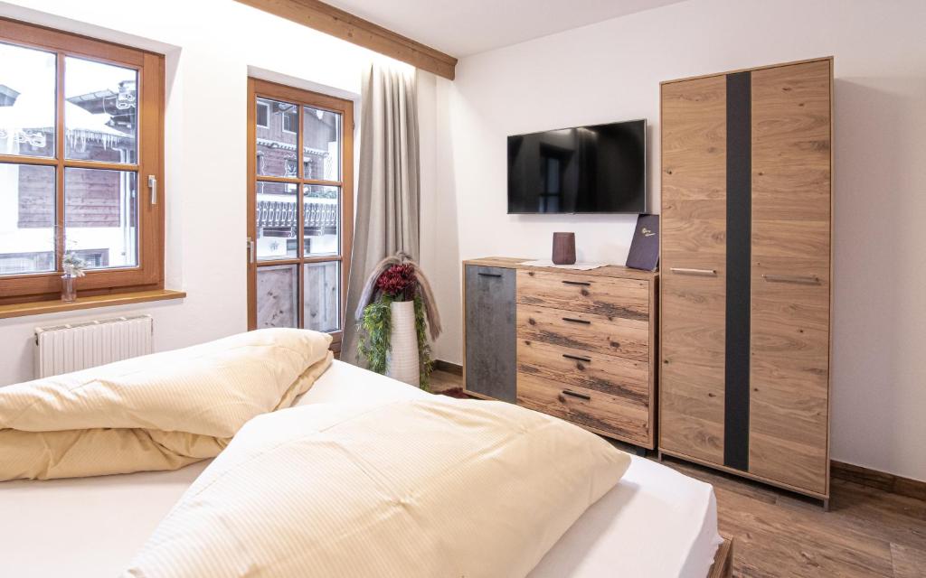 Łóżko lub łóżka w pokoju w obiekcie La Tombola Appartements