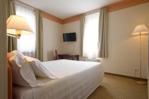 Posteľ alebo postele v izbe v ubytovaní Cora Hotels Leon d'Oro