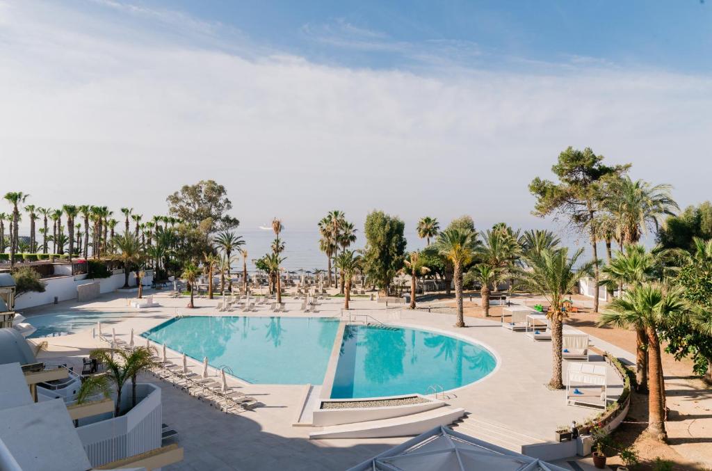 an image of a swimming pool at a resort at Elias Beach Hotel in Limassol