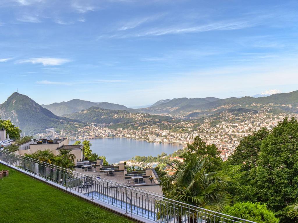 a view of a body of water with a city at Apartment Residenza Monte Bré - Apt-204 Haus2 by Interhome in Lugano