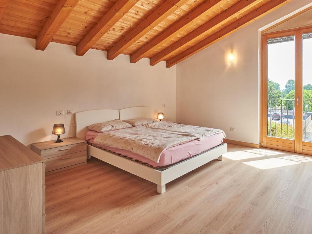 Postel nebo postele na pokoji v ubytování Holiday Home Gamma by Interhome