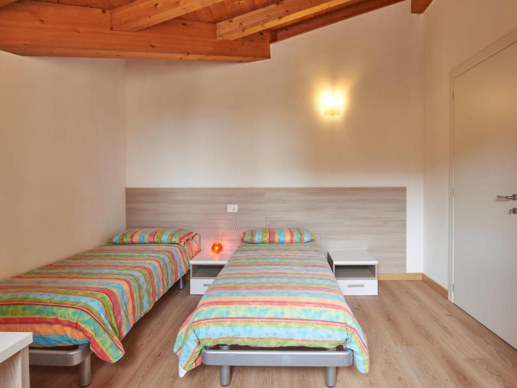 Postel nebo postele na pokoji v ubytování Holiday Home Gamma by Interhome