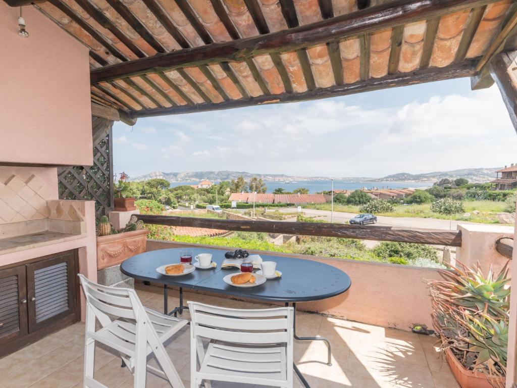 a table and chairs on a patio with a view at Apartment Spinnaker by Interhome in Palau