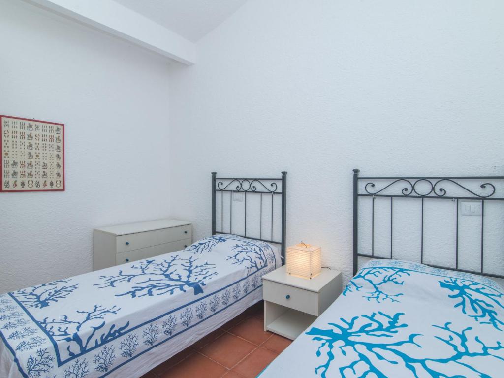 Łóżko lub łóżka w pokoju w obiekcie Holiday Home Nicoletta by Interhome