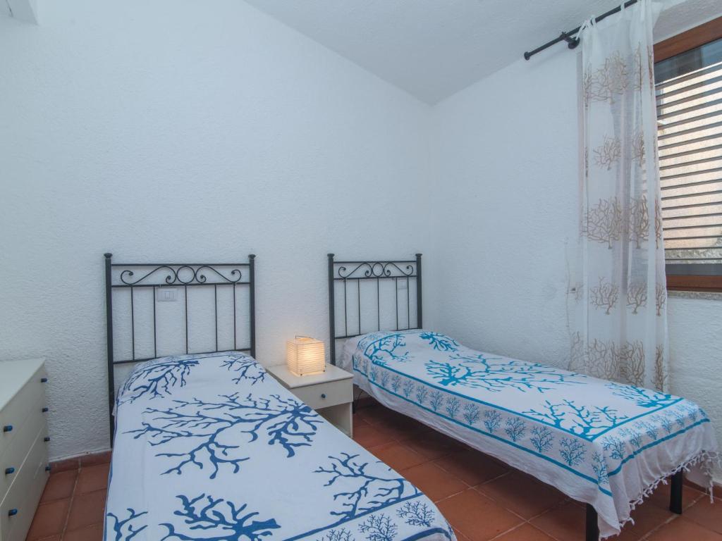 Łóżko lub łóżka w pokoju w obiekcie Holiday Home Nicoletta by Interhome