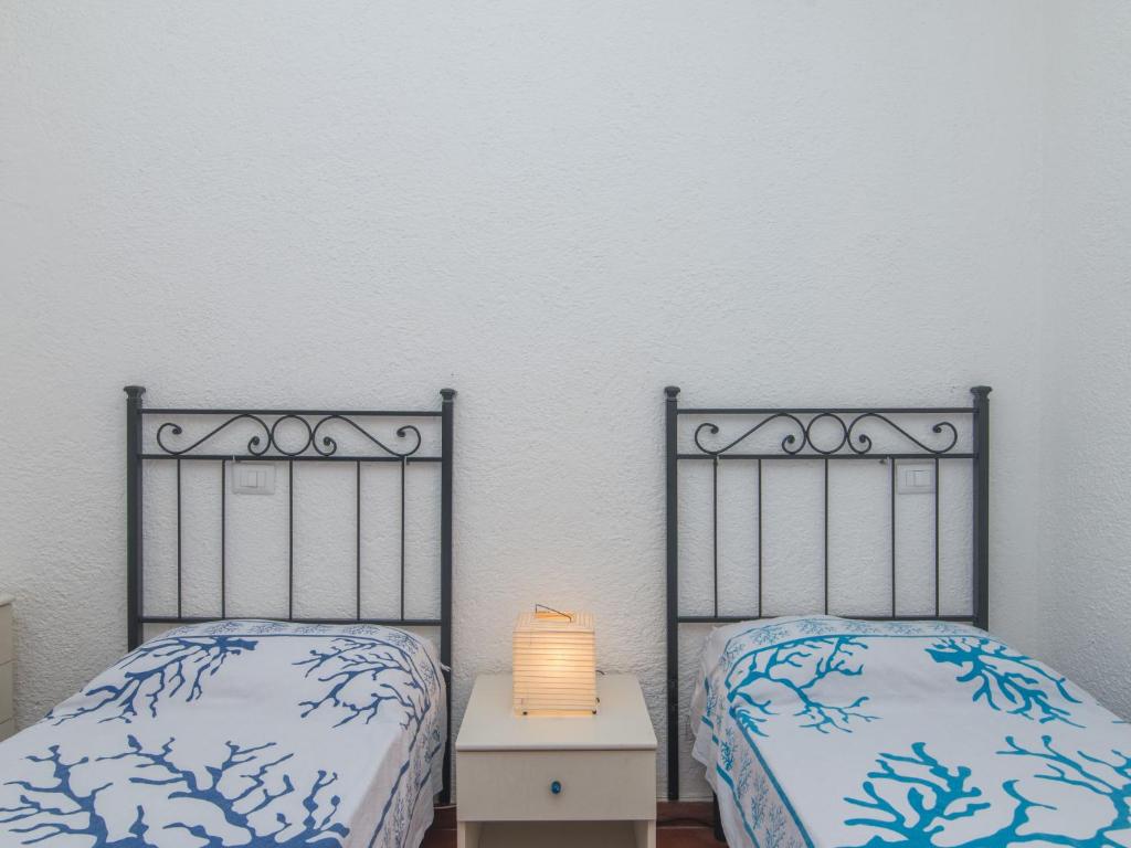 Łóżko lub łóżka w pokoju w obiekcie Holiday Home Nicoletta by Interhome