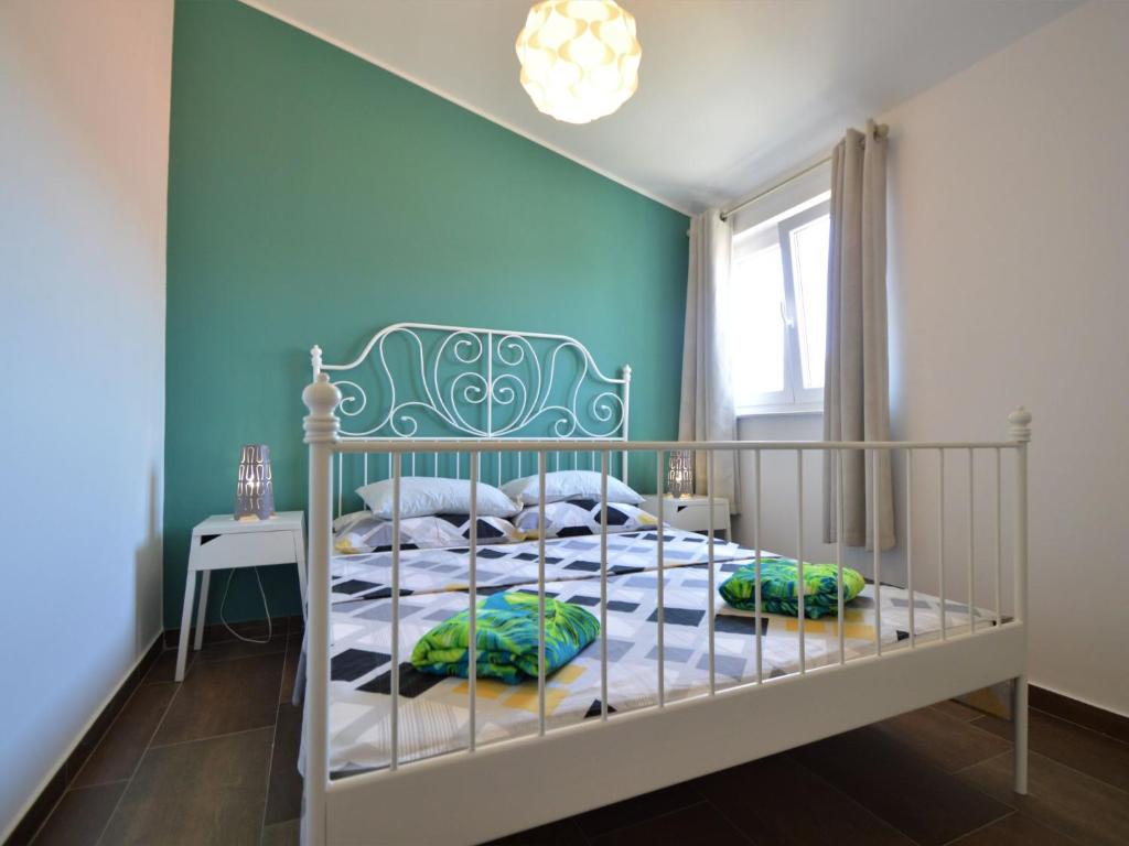 Postel nebo postele na pokoji v ubytování Apartment Ivka-2 by Interhome