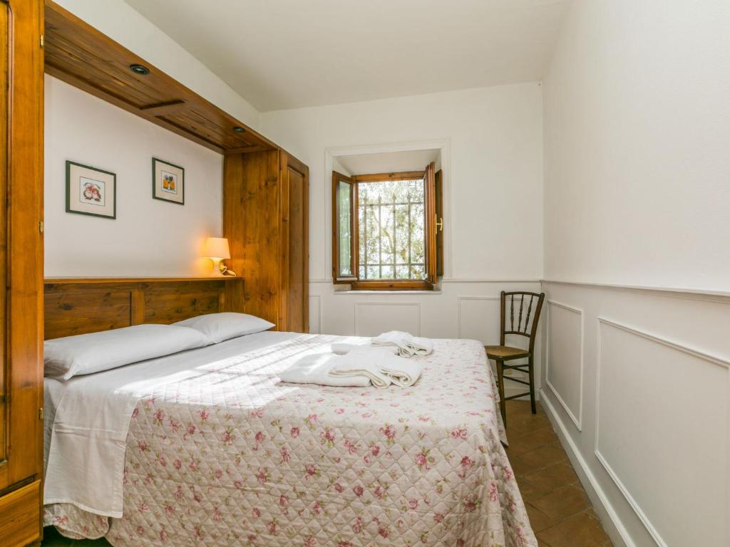 Łóżko lub łóżka w pokoju w obiekcie Holiday Home Appartamento Piccolo by Interhome