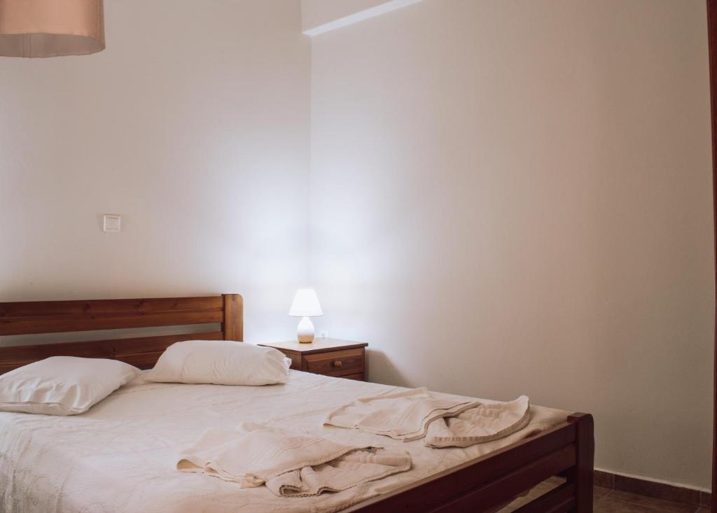 A bed or beds in a room at Chaniotis Home, In the heart of Kinidaros
