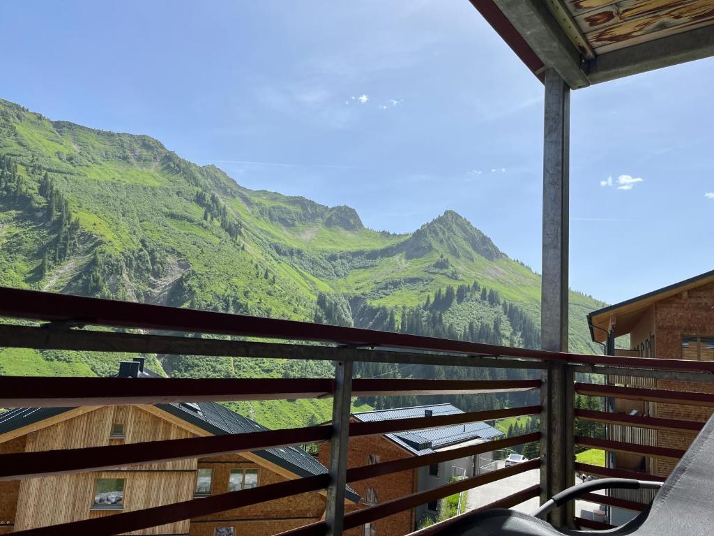 a view of the mountains from a balcony at Appartement Bellevue in Damuls