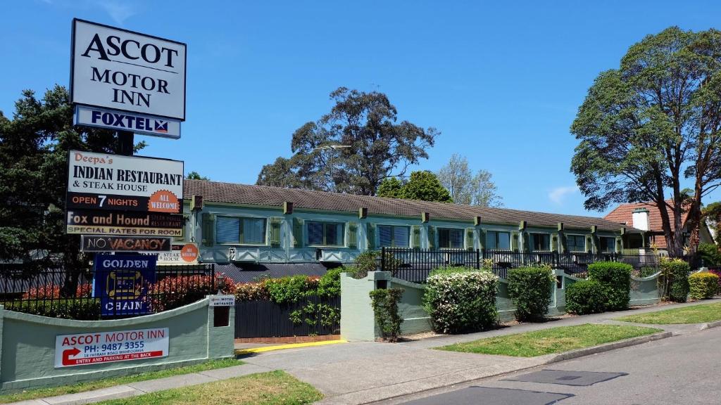 an asot motor inn sign in front of a building at Ascot Motor Inn in Hornsby