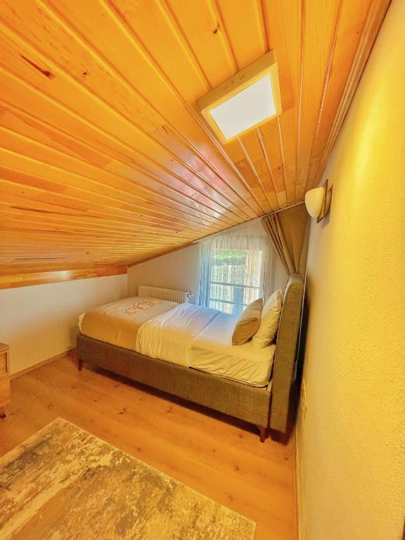 A bed or beds in a room at İmera Suite Otel
