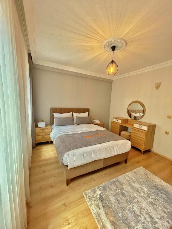 A bed or beds in a room at İmera Suite Otel