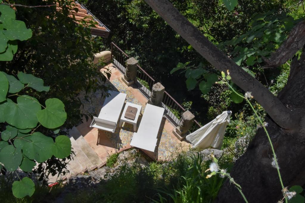 an overhead view of a table and chair on a stairs at Bella Baia Relais in Maiori