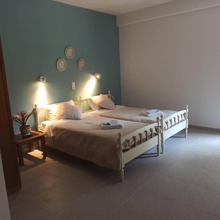 A bed or beds in a room at Andreas Apartments