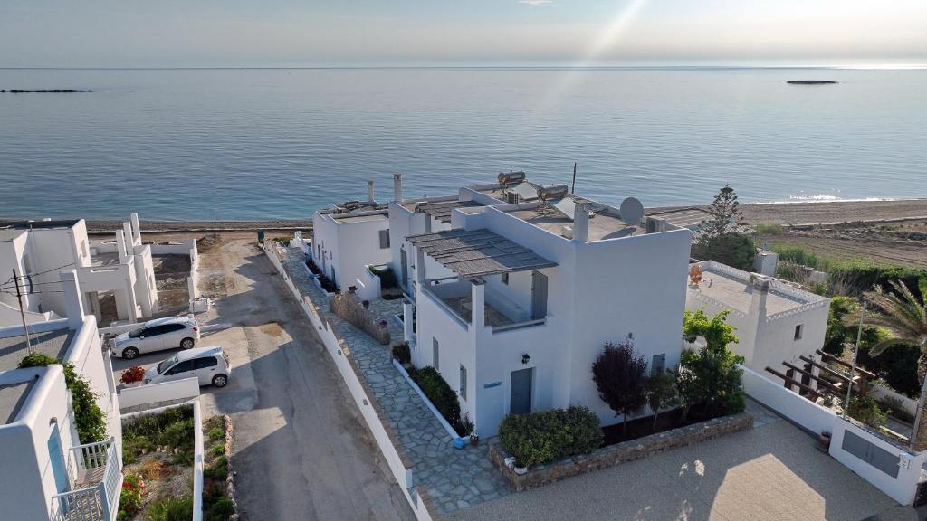 an aerial view of a white house by the water at Ιάνθη Ianthi Boutique Guesthouses Skyros in Skiros