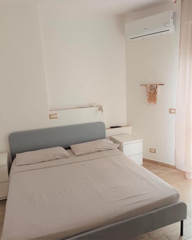 Postel nebo postele na pokoji v ubytování White Beach