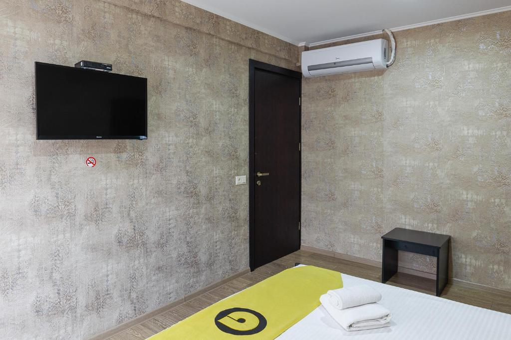 Postel nebo postele na pokoji v ubytování Aura Plaza Hotel