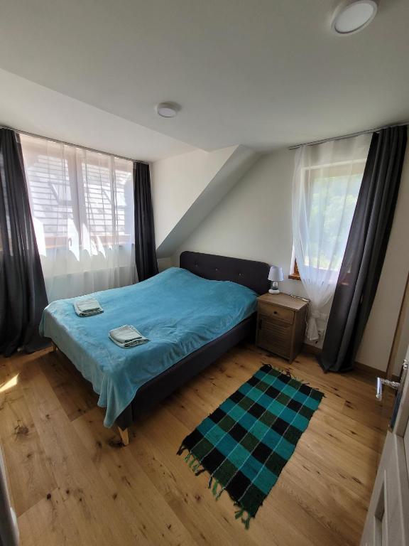 Postel nebo postele na pokoji v ubytování Artur Apartment Myto