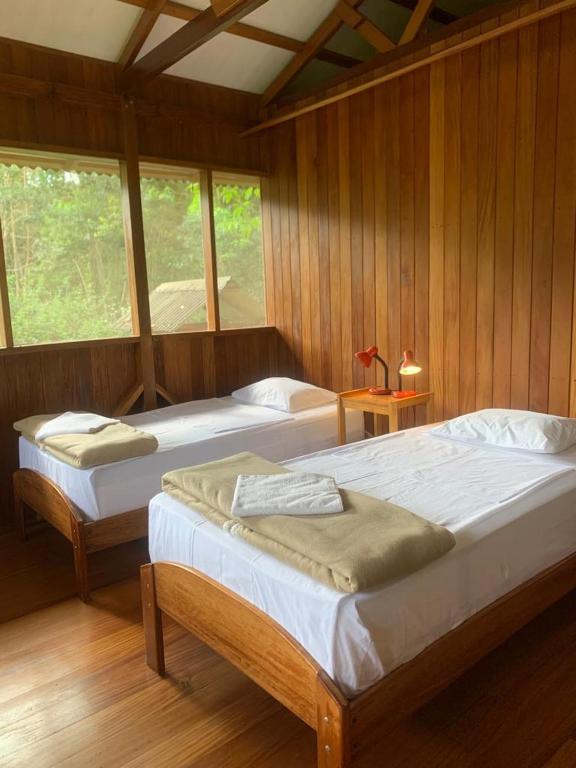 Postel nebo postele na pokoji v ubytování Kuporo lodge
