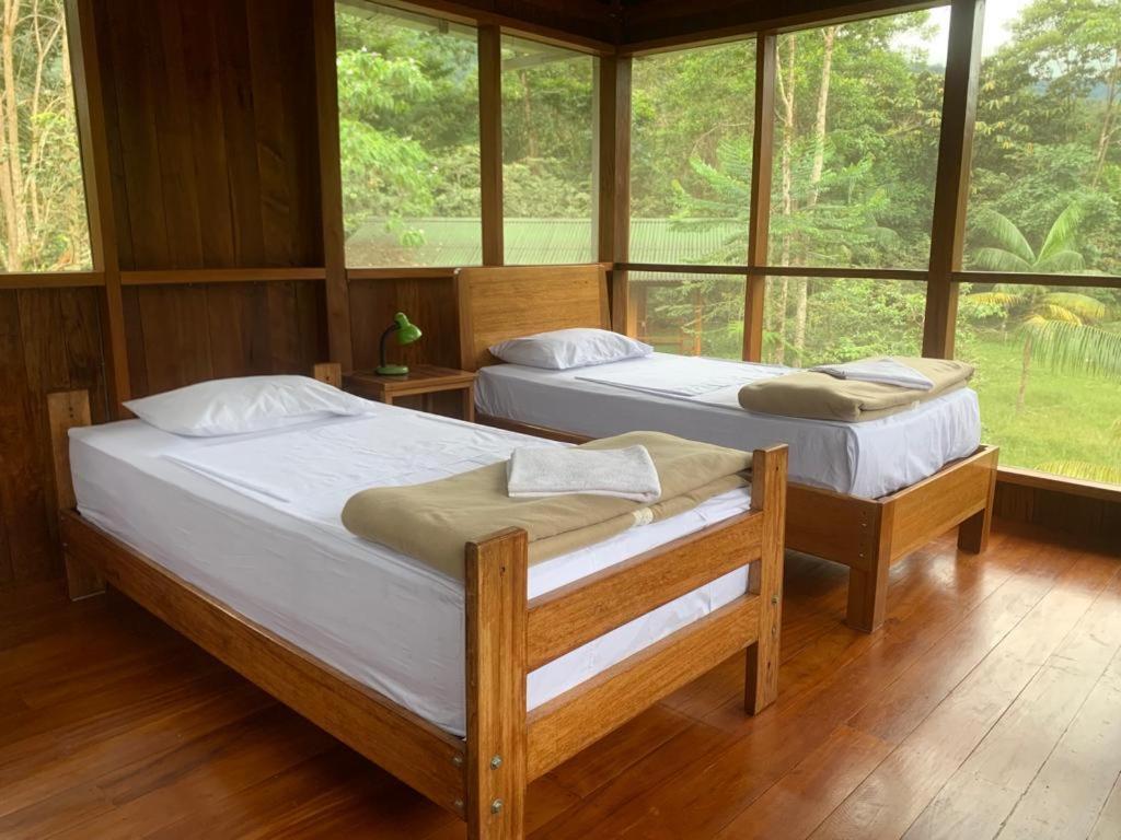Postel nebo postele na pokoji v ubytování Kuporo lodge