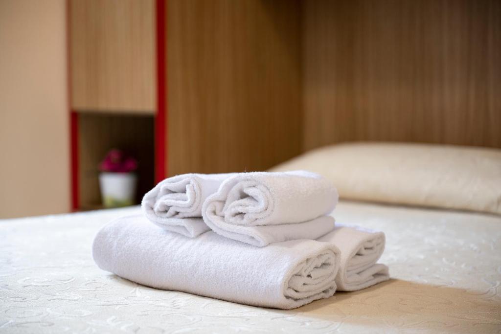 Postel nebo postele na pokoji v ubytování Hotel Ragno