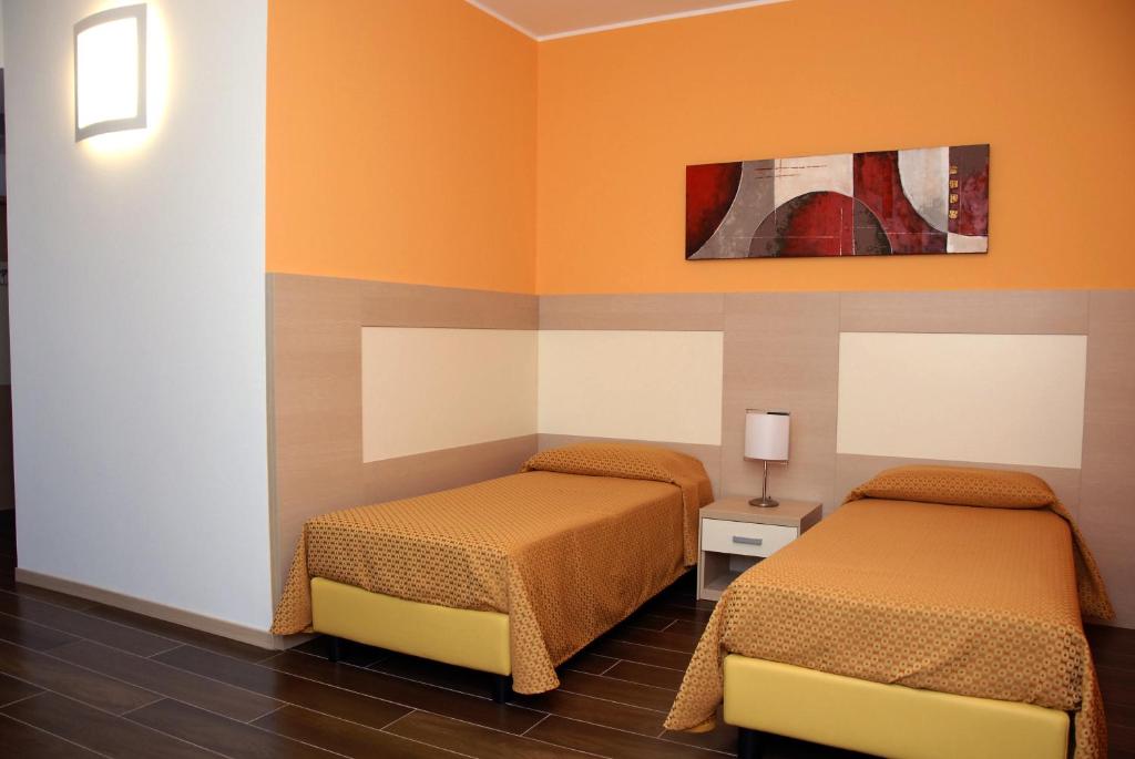 Postel nebo postele na pokoji v ubytování Groane Hotel Residence