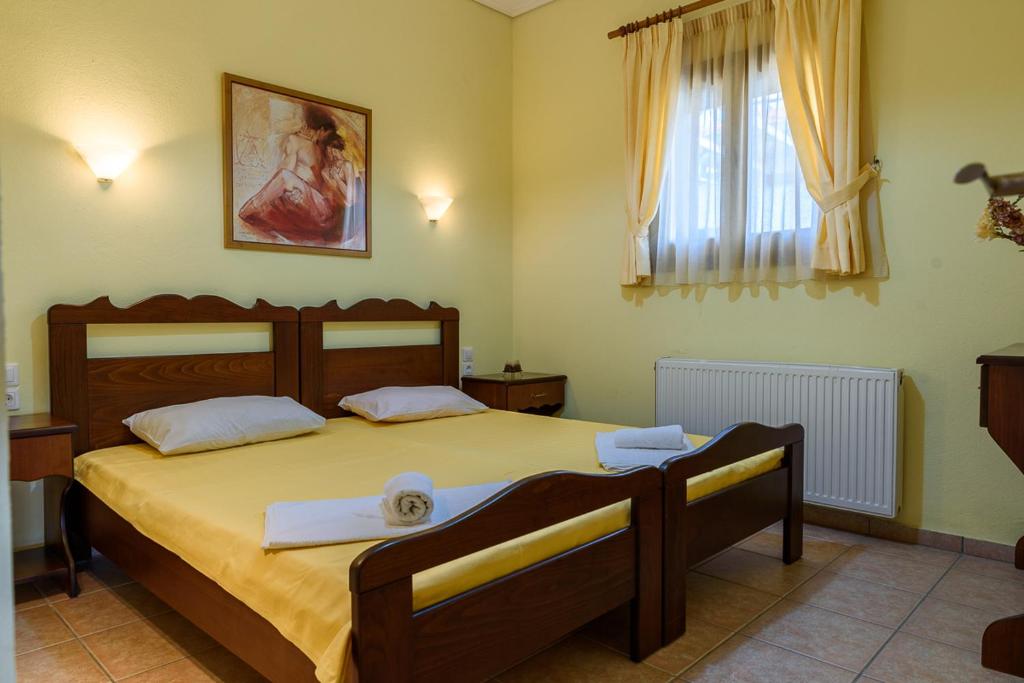 Postel nebo postele na pokoji v ubytování Leonidas