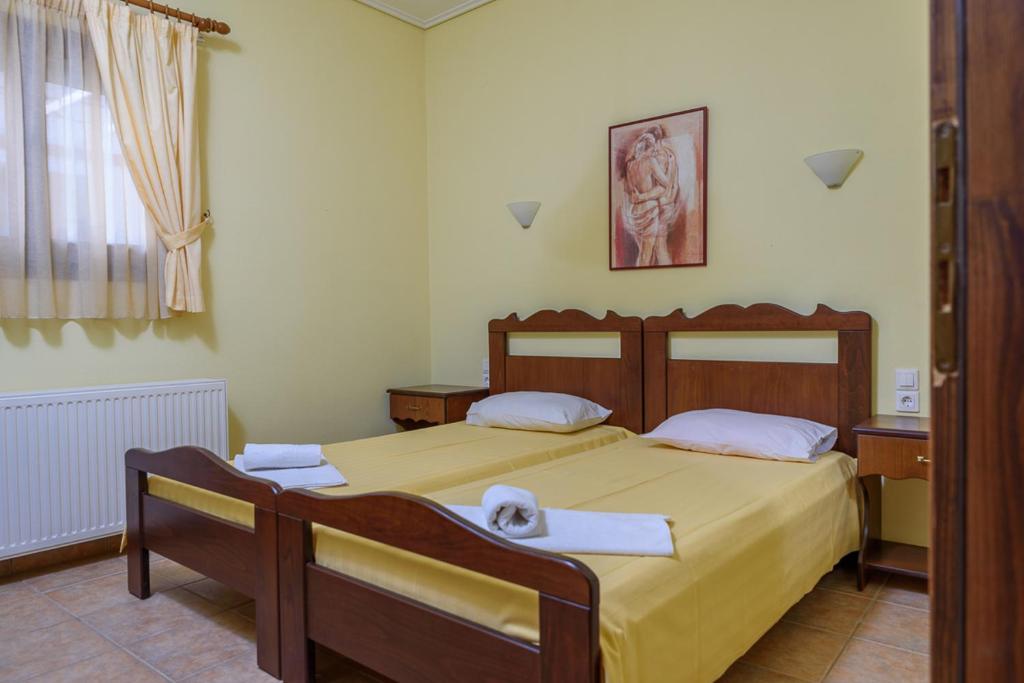 Postel nebo postele na pokoji v ubytování Leonidas