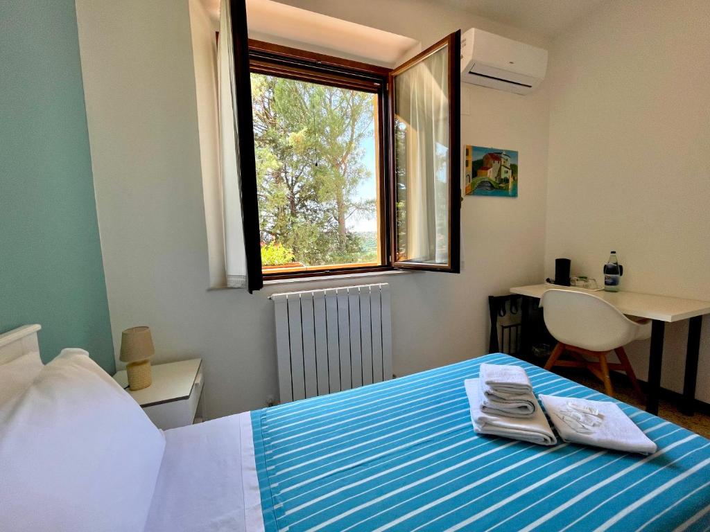 Postel nebo postele na pokoji v ubytování Agriturismo con cucina Il Favaio