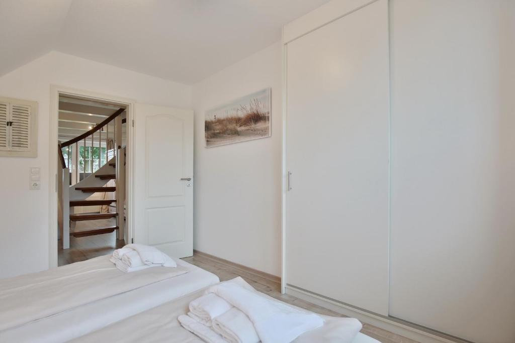 Postel nebo postele na pokoji v ubytování Strandhus Strandhus