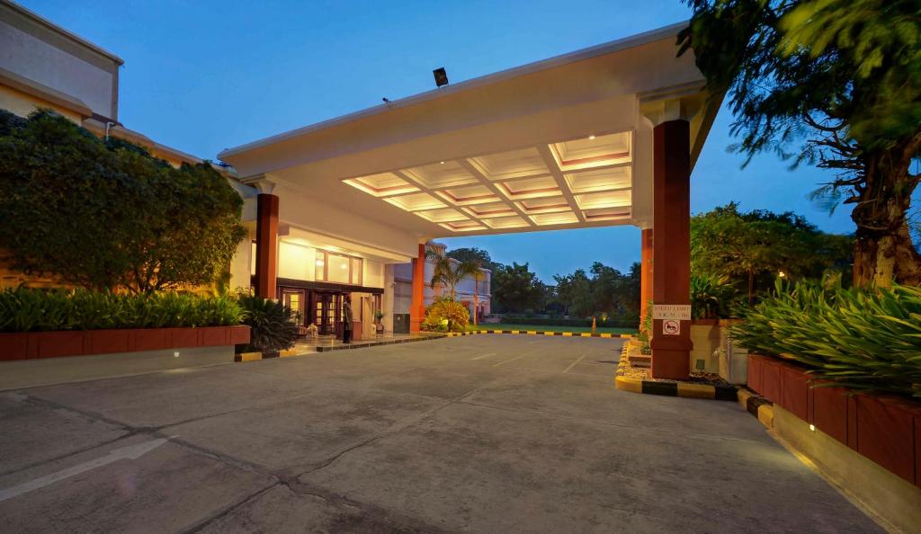 an empty parking lot of a building at The Ummed Ahmedabad Airport in Ahmedabad