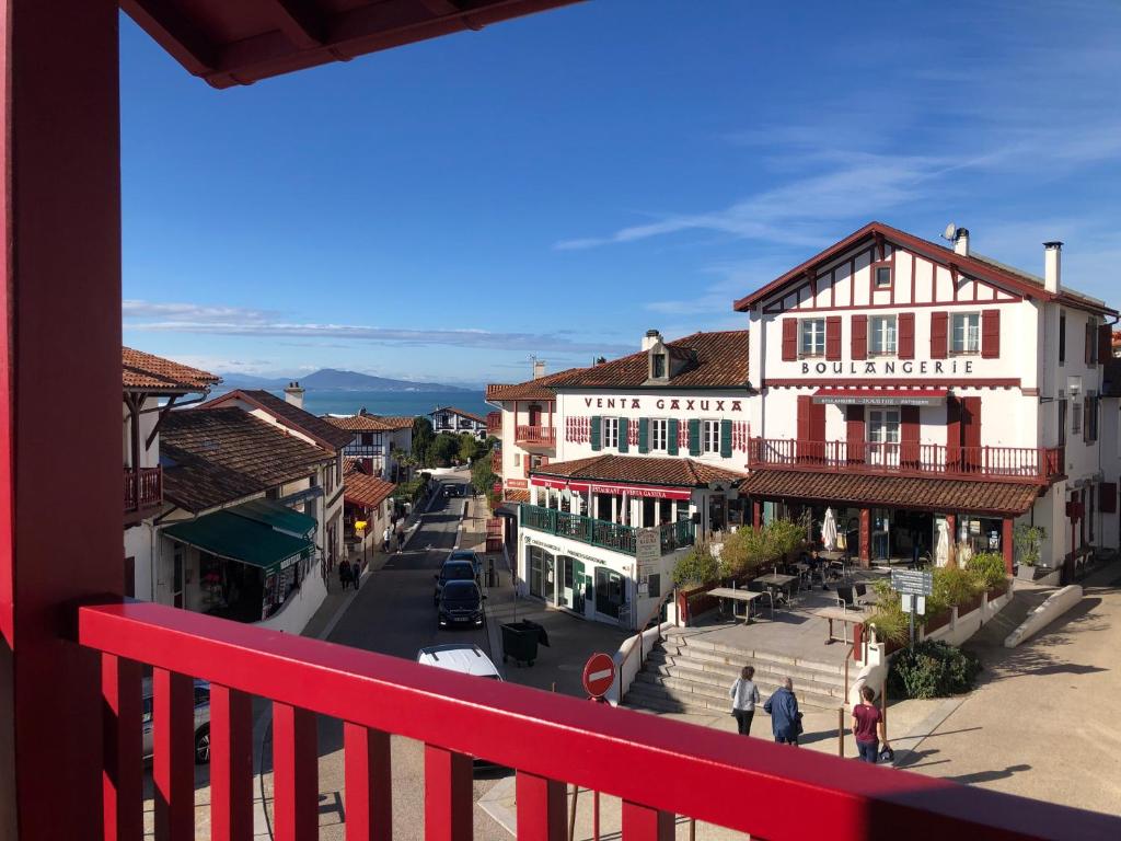 a view from a balcony of a town with buildings at Hotel du Fronton in Bidart