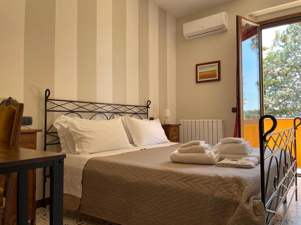 Postel nebo postele na pokoji v ubytování Agriturismo con cucina Il Favaio