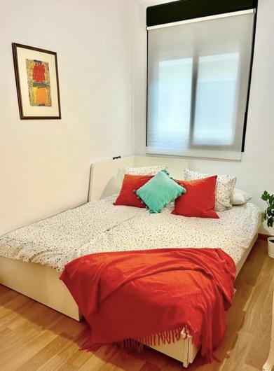 A bed or beds in a room at -MalagaSunApts- Central FreeParking RooftopPool